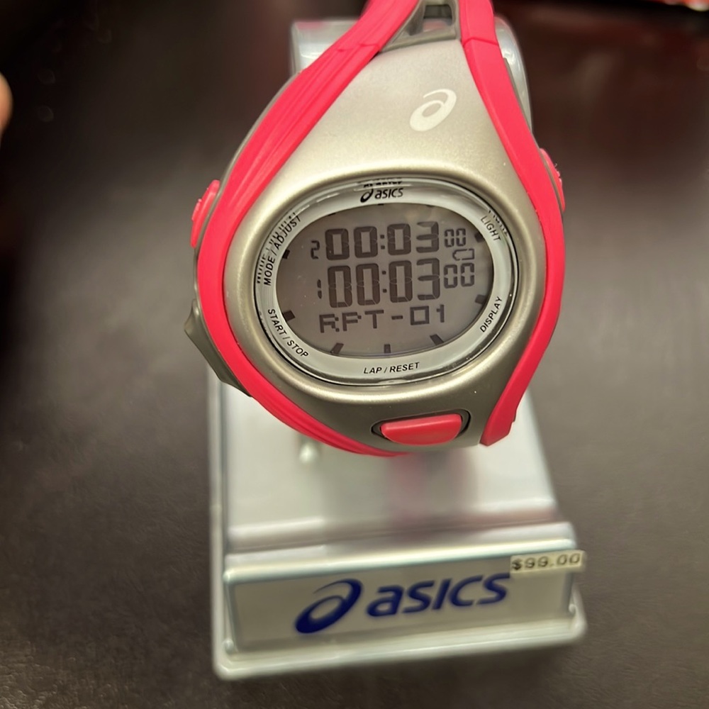 Asisc band watch pink and grey two tone band. Water prof and many other featurs.
